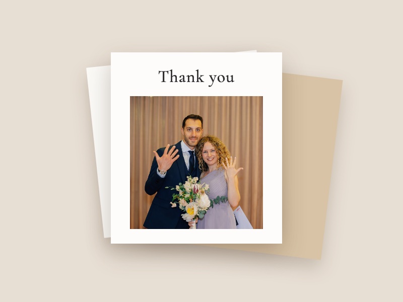 Greeting card saying Thank you above a couple showing their wedding rings, on a second card and a kraft envelope